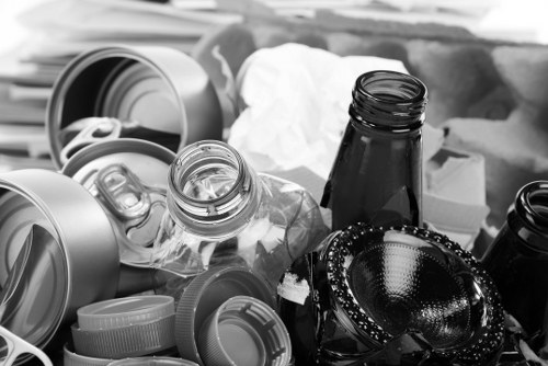 Company van and crew preparing a skip for hire