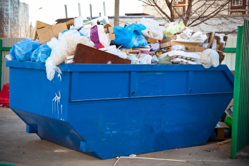 Hazardous waste containers at a local disposal site in Osterley