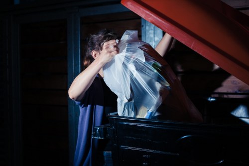 Workers segregating construction waste materials